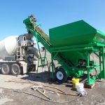 Fort Yukon - Fastway batch plant and mixer batching concrete for 150 yrds on water treatment plant.