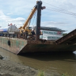 Kwethluk - Smaller barge bringing equipment and materials up the Kuskokwim River for new school.