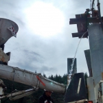 Hoonah- Putz TK70 pumping flowable grout through tremie to fill pilings and float out water.