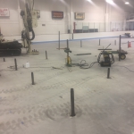 Boeke Ice Arena - A large area about 40' in diameter in the center of the rink settled up to 3". Compaction grouting was used with low-mobility grout injected down to 18' to stabilize soft layers and raise the slab. Injection pipes had to inserted between coolant tubes 3" on center.