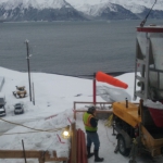 Seward- lifting shotcrete a bucket at a time to feed the pump.