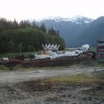 Tyee Lk-Truck, pump, and super bags of concrete materials arriving by barge to the end of Bradfield Canal near Wrangell.