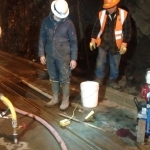 Whittier Tunnel-Lifting and leveling precast panels which RR rails are mounted to, at night.  Grout was mixed in 6 cu ft mixer and injected with single piston pump through custom made, 1" ports in panels.