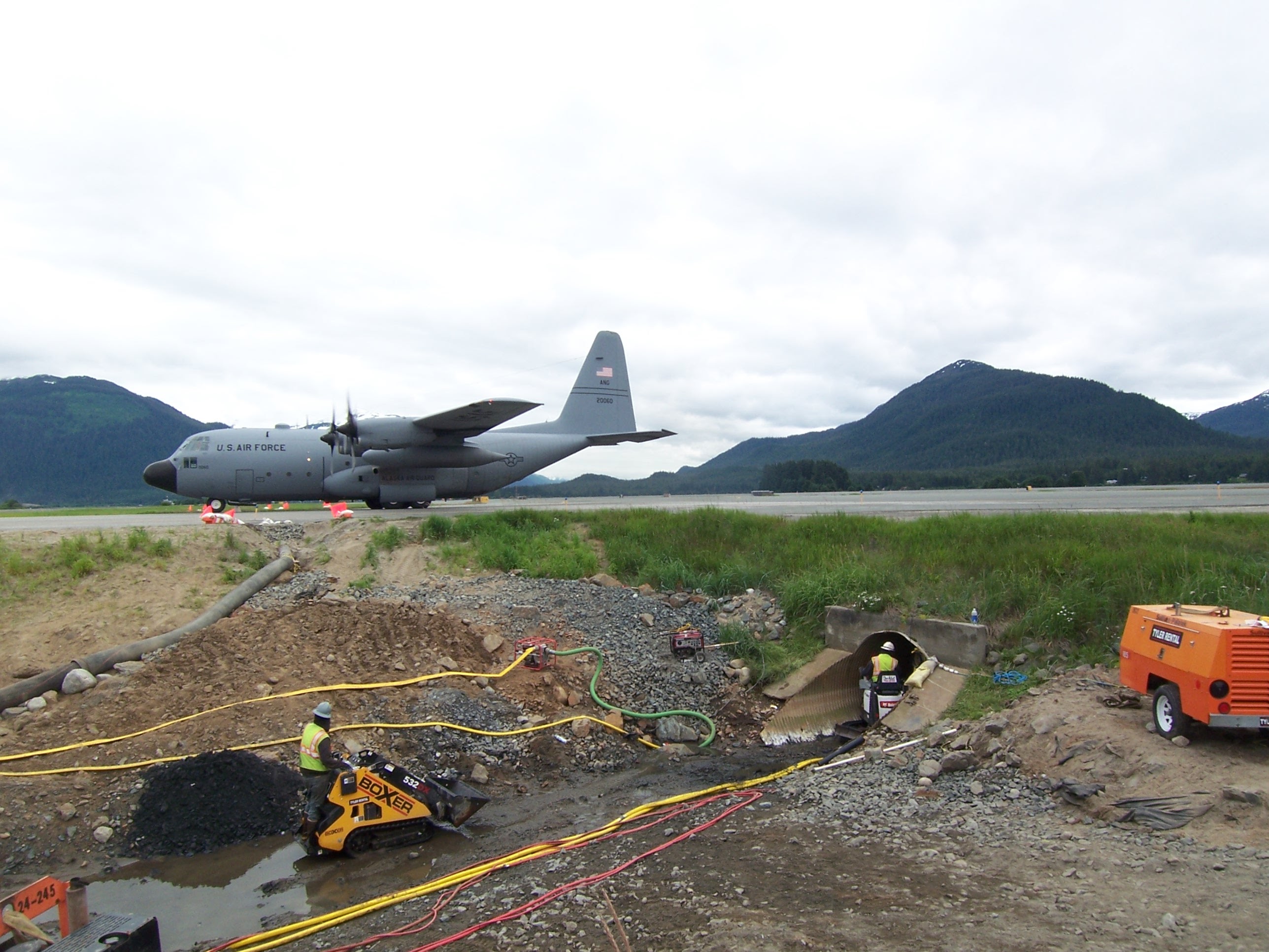 Juneau - Preparing and cleaning host pipe to receive a sliplined liner pipe in Jordan Cr under Juneau Airport.