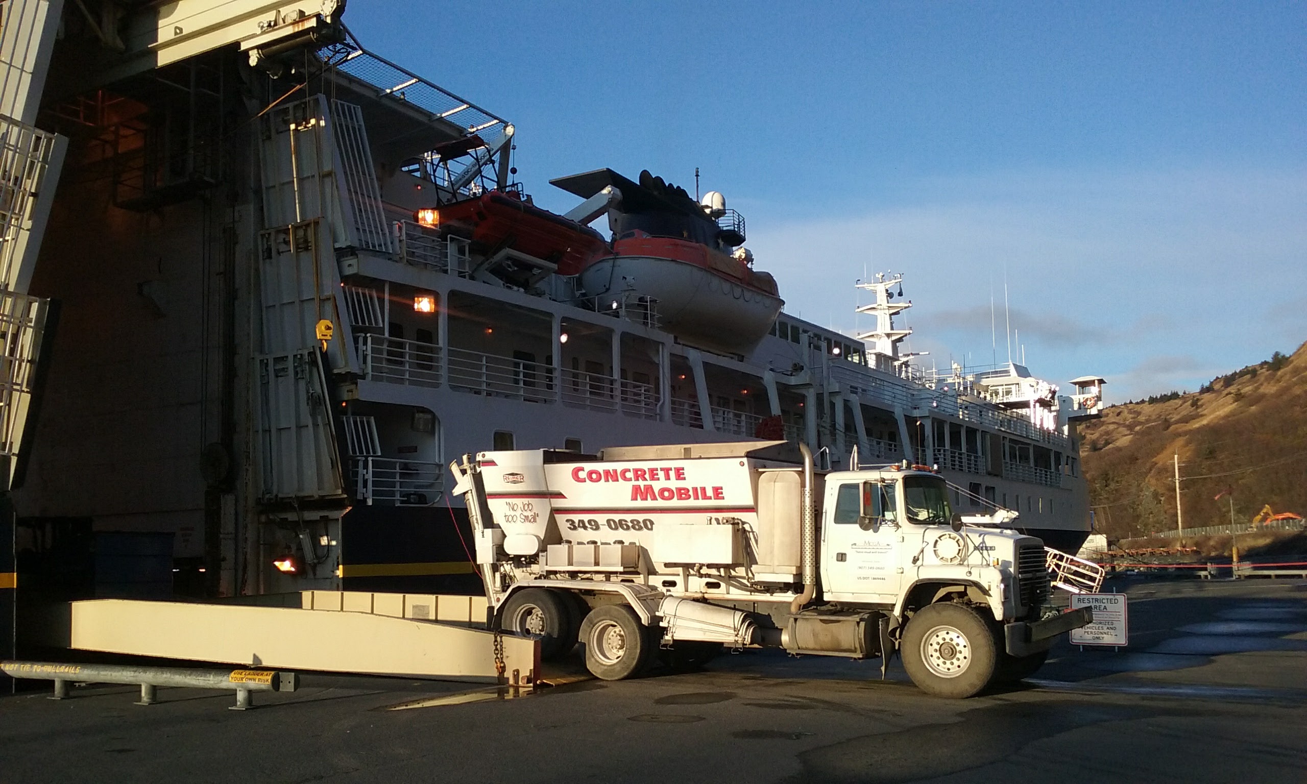 Kodiak-Volumetric mixer coming off an overnight ferry ride from Homer for KEA building lifting project.