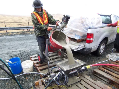 Adak - Grouting equipment and materials had to be flown in and mixed  at site.