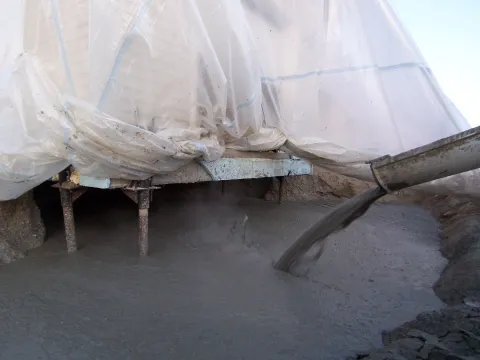 Fairbanks - Low-density self-leveling 40 lb grout was used to flow under building with 100% compaction, setting up overnight, at over 200 psi.