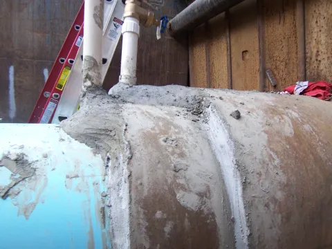 Hiland Rd- Injecting cellular grout into a 2 stage sliplined pipe.